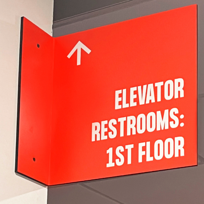 Wayfinding elevator sign red
